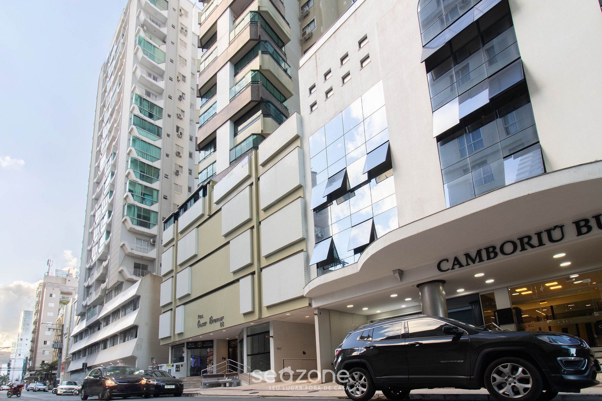 A modern building with a storefront labeled "Camboriu Boutique Hotel".