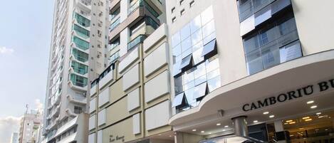 A modern building with a storefront labeled "Camboriu Boutique Hotel".