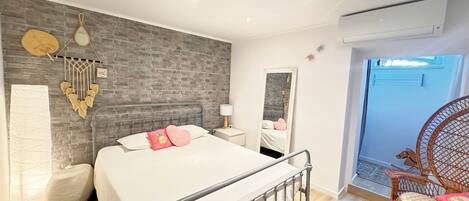 1 bedroom, desk, iron/ironing board, travel crib