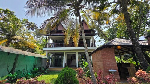 Mango Lantern Villa By Mirth Kollam