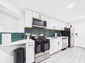Fridge, microwave, oven, stovetop - Elite 2BR Art Deco retreat. Steps to Wrigley. (Chicago)