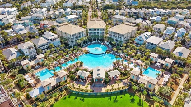 A resort with multiple buildings, a central pool, and surrounding greenery. - Barefoot on 30a by Stay on 30a (Seacrest Beach)