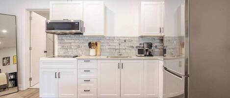 Fridge, microwave, coffee/tea maker, toaster