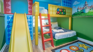 A children's room with a bunk bed, a slide, and a ladder. - Spacious 4-bedroom townhome, perfect for family getaways! (Kissimmee)