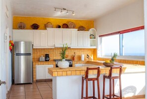 Fridge, stovetop, coffee/tea maker, cookware/dishes/utensils