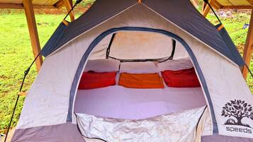 A tent with a sleeping area, a tree logo, and a "speeds" brand.