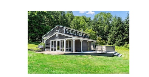 Quaint lodge set on a tranquil wooded lot in Ellicottville
