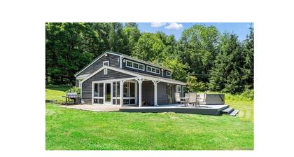 Quaint lodge set on a tranquil wooded lot in Ellicottville