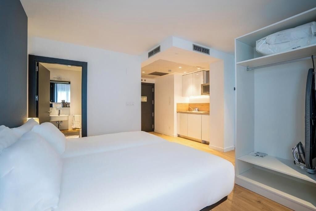 Settle in with a comfy bed and handy kitchenette nearby.