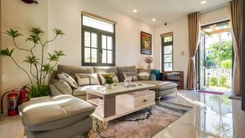 Luxury Villa, Garden View | Living area | 55-inch Smart TV with satellite channels