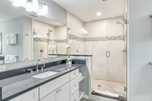 Shower, hair dryer, towels, shampoo