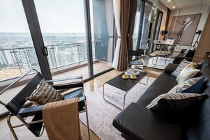 Family Suite, 3 Bedrooms, Club Lounge Access, City View | Living area | 65-inch Smart TV with cable channels, Netflix, smart speakers