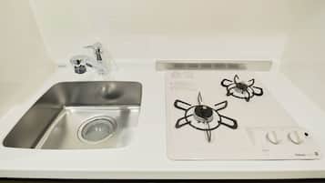 Fridge, microwave, stovetop, cookware/dishes/utensils