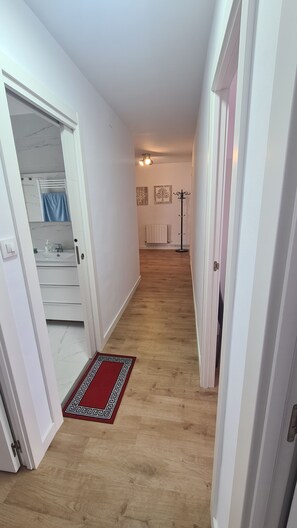 Shower, hair dryer, towels, toilet paper