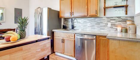 Fridge, stovetop, dishwasher, coffee/tea maker