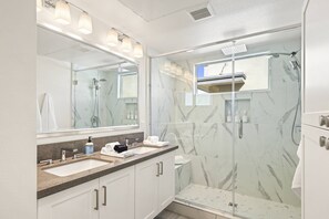 Shower, hair dryer, towels, shampoo