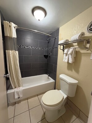 Bathtub, hair dryer, towels, soap