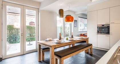 Appartement rénové avec terrasse et jardin
