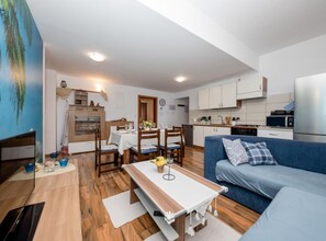 Apartment (Three Bedroom Apartment with Terrace ) | Living room | 32-inch flat-screen TV with satellite channels - Apartments Scerbe Gordana & Miljenko Rab (Rab)