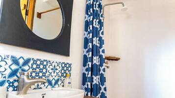 Shower, towels, soap, toilet paper