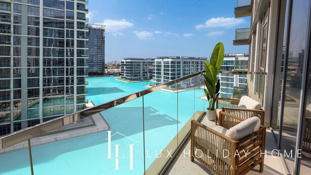 A high-rise building with a rooftop pool, luxury furniture, and a clear view of the cityscape. - LUX The Burj Khalifa Lagoon View Suite 4 (Dubai)