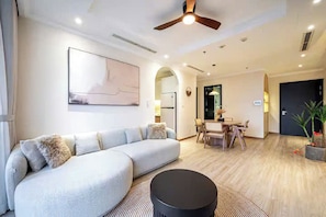 Family Suite, 3 Bedrooms, Club lounge access, City View | Living area | 65-inch Smart TV with cable channels, fireplace, Netflix - Luxeasy Style Landmark 81 (Ho Chi Minh)