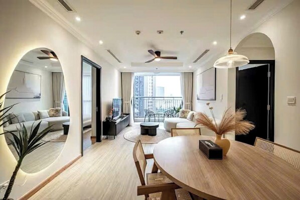 Family Suite, 3 Bedrooms, Club Lounge Access, City View | Living area | 65-inch Smart TV with cable channels, fireplace, Netflix - Luxeasy Style Landmark 81 (Ho Chi Minh)