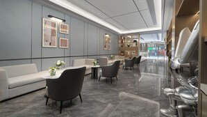 A modern hotel lobby with a seating area, a reception desk, and a view of the street. - YiZhi HotelShangxiajiu Pedestrian Stree (Guangzhou)