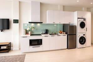 Luxury Studio Suite, City View | Private kitchen | Fridge, microwave, stovetop, cookware/dishes/utensils