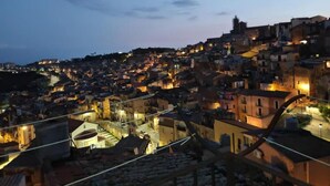 A densely packed urban area with buildings at various heights, some with visible balconies and terraces. - Comfort, style and views: your perfect stay at Civico24rooms (Caltagirone)