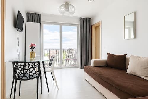 Deluxe appartement, balkon, uitzicht op de stad | Woonruimte