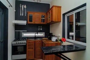 Classic Apartment, 3 Bedrooms, Balcony, Garden View | Private kitchen - Cattleya Guest House (Nosy Be)