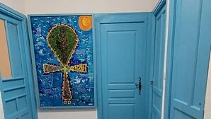 A hallway with blue doors, a checkered floor, and a wall-mounted artwork. - 6-person apartment ideally located on the quiet side of the port (Port-Vendres)