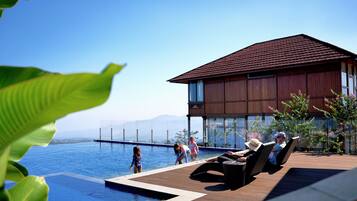 2 outdoor pools, pool umbrellas, pool loungers