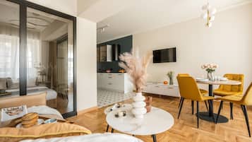 Comfort Apartment, 1 Queen Bed with Sofa bed, Kitchenette | Living area | Flat-screen TV