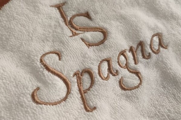 A towel with embroidered text. - Magic of the Spanish Steps (Roma)