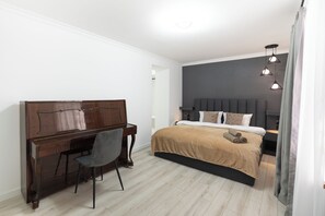 A bedroom with a bed, a desk, and a chair. - The Sakartvelo House (Tbilisi)