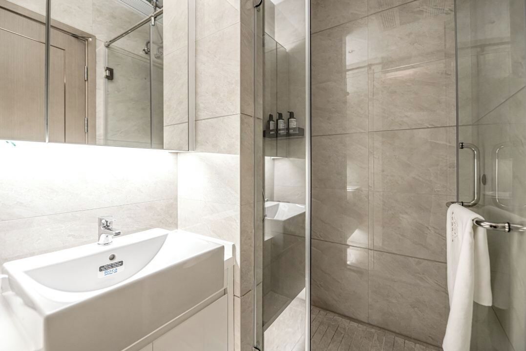 Shower, hair dryer, slippers, towels