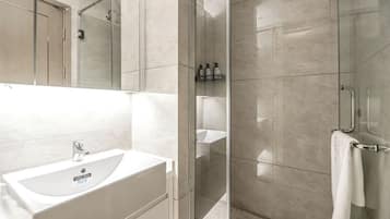 Shower, hair dryer, slippers, towels
