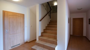 A staircase with wooden steps and a handrail, leading to an upper floor. - Albrechtice Laq016 in Albrechtice v Jizersk ch hor ch (Albrechtice v Jizerských horách)