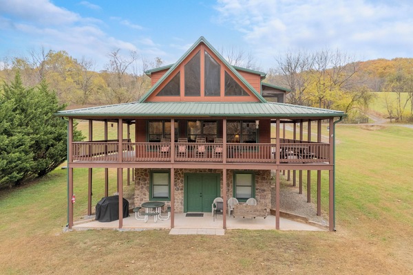 Charming two-story cabin with wraparound porch & scenic views—perfect for peaceful getaways.