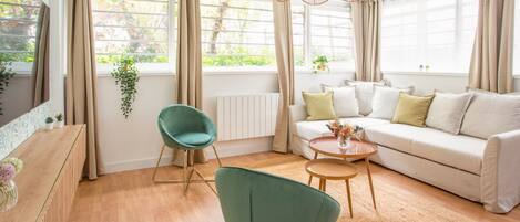 Apartment, Garden View | Living area | 32-inch Smart TV with cable channels, Netflix, streaming services