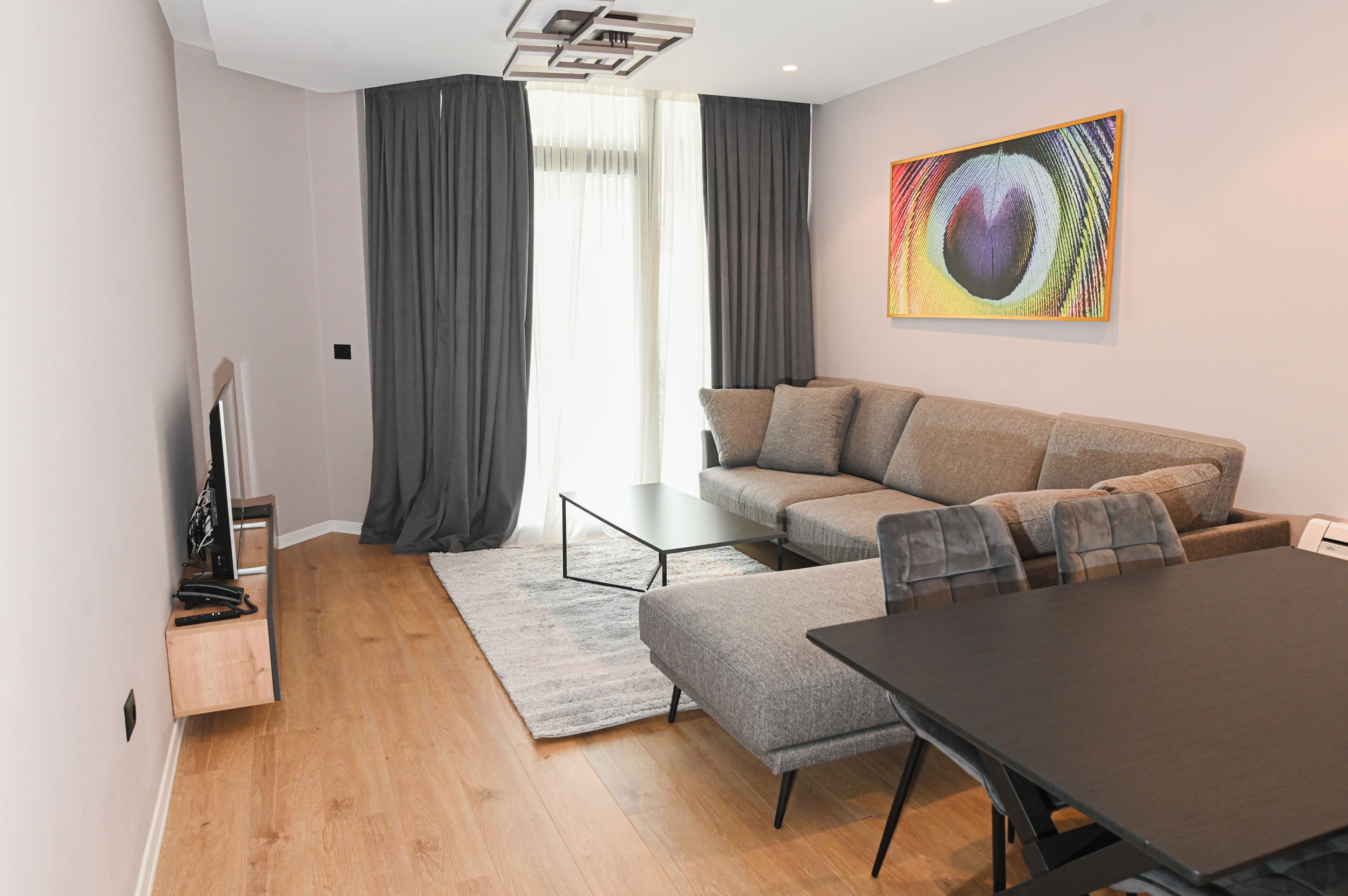Deluxe Apartment | Living area | 50-cm Smart TV with satellite channels