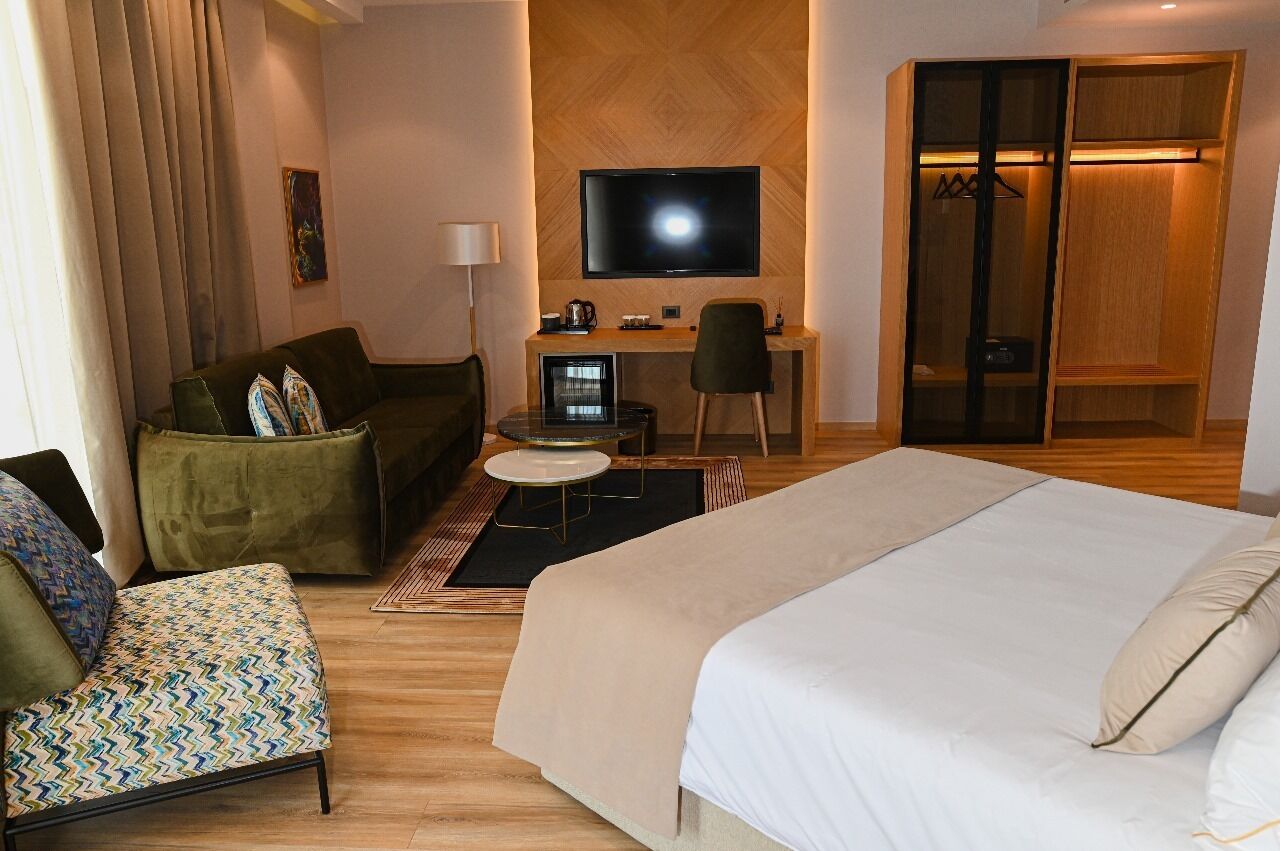 Deluxe Quadruple Room, Sea View | Hypo-allergenic bedding, minibar, desk, soundproofing