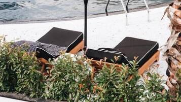 Seasonal outdoor pool, pool umbrellas, sun loungers