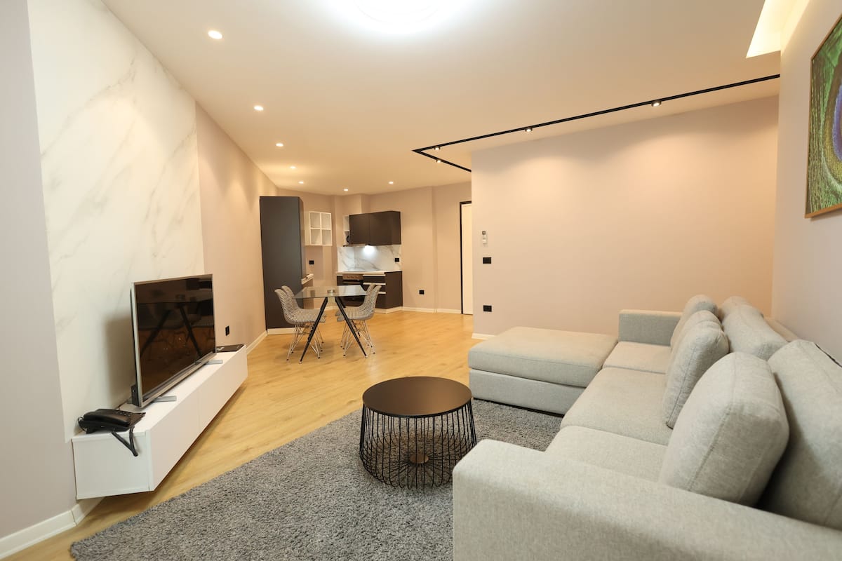 Deluxe Apartment | Living area | 50-cm Smart TV with satellite channels