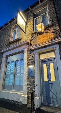 Exterior detail. Located in the heart of Glossop in the High Peak, Westwood Boutique Aparthotel combines comfort with convenience. Set against the breath-taking backdrop of the Peak District.