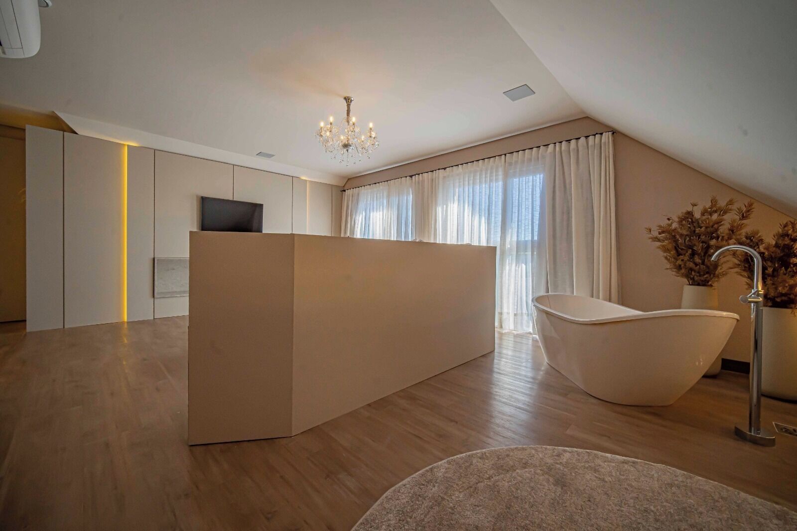 A modern bathroom with a freestanding bathtub, a shower, and a vanity.