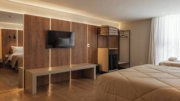 Chambre Triple Deluxe | Coffres-forts dans les chambres, rideaux occultants