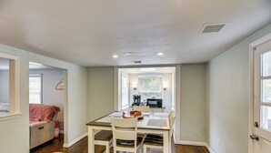 A compact kitchen with a dining area, a microwave, and a coffee maker. - Stay & Play in Plymouth: Spacious Home w/ Yard (Plymouth)
